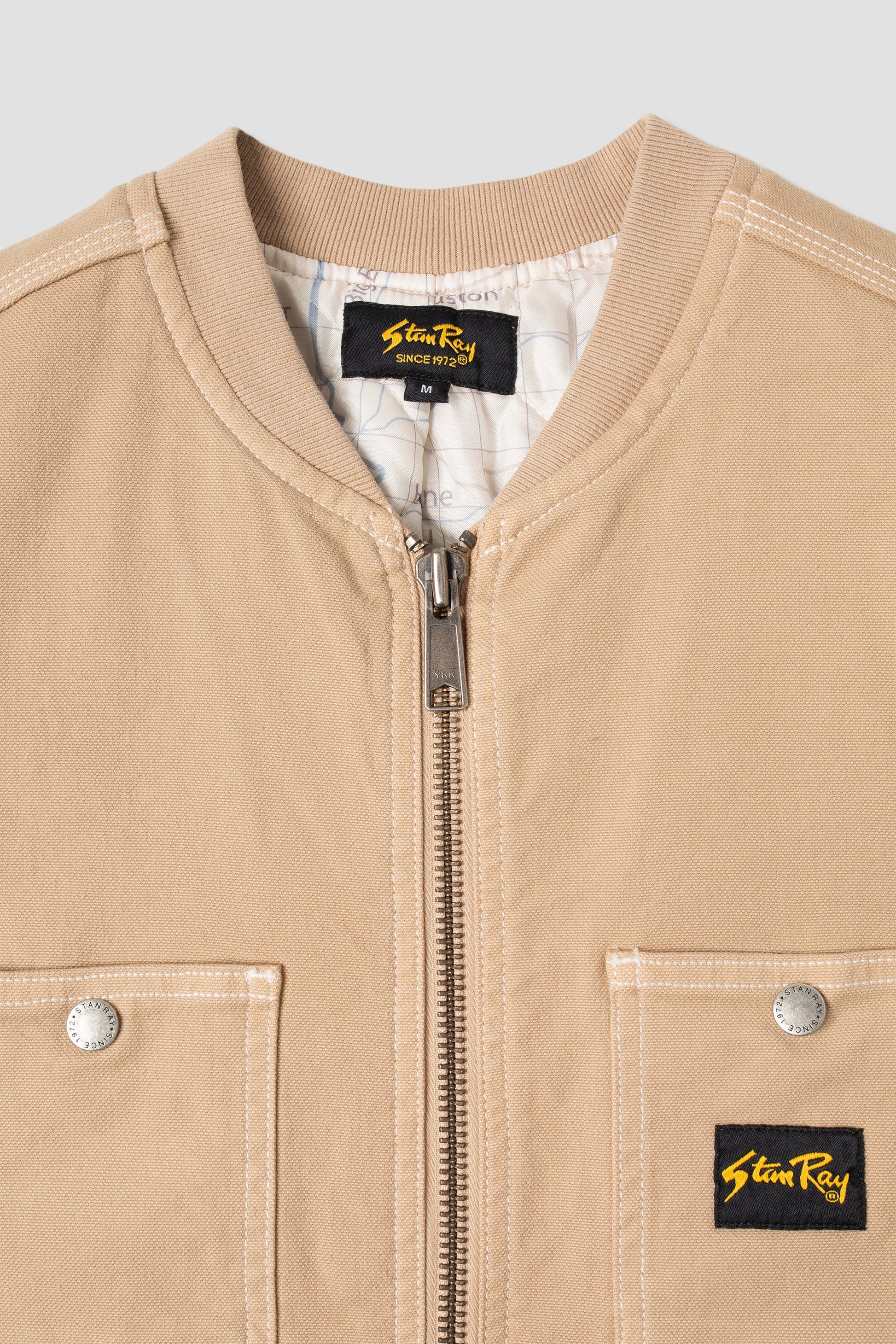 Close-up of Stan Ray vest zipper and pockets in Antique Khaki Duck