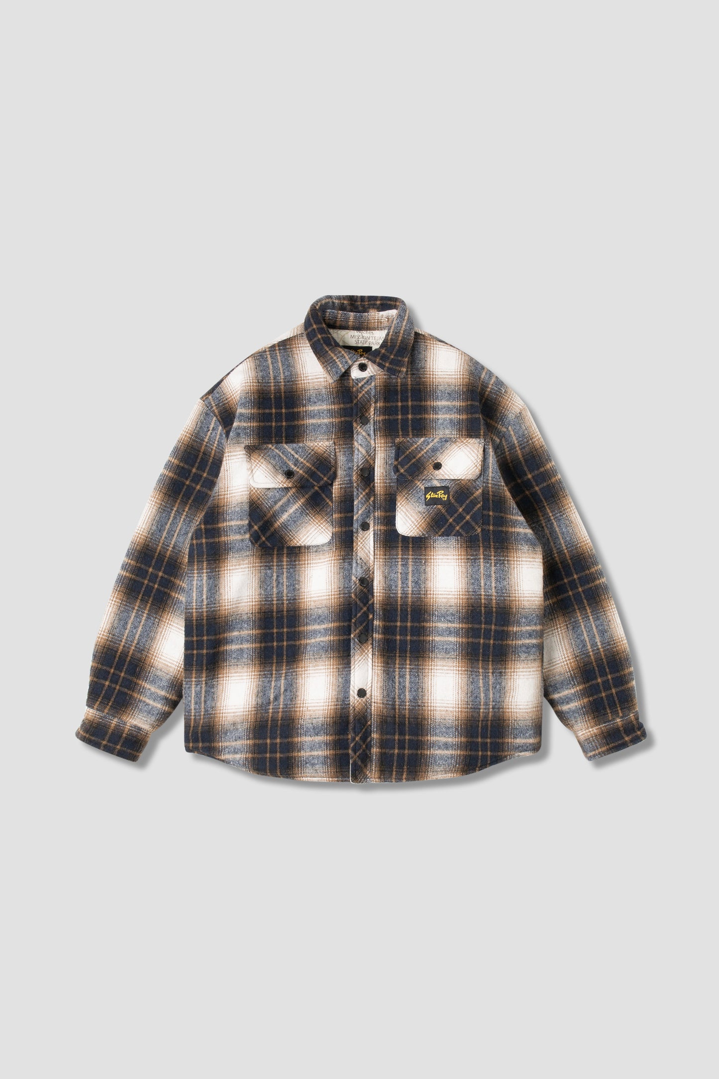 Front view of navy plaid quilted overshirt