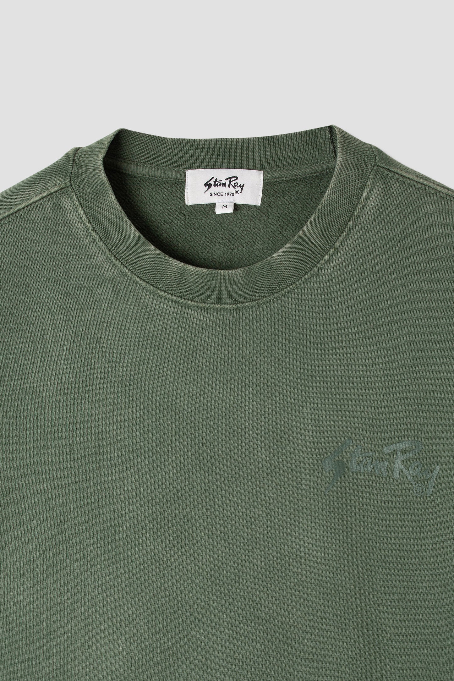 Close-up of Stan OG Crew neckline and logo