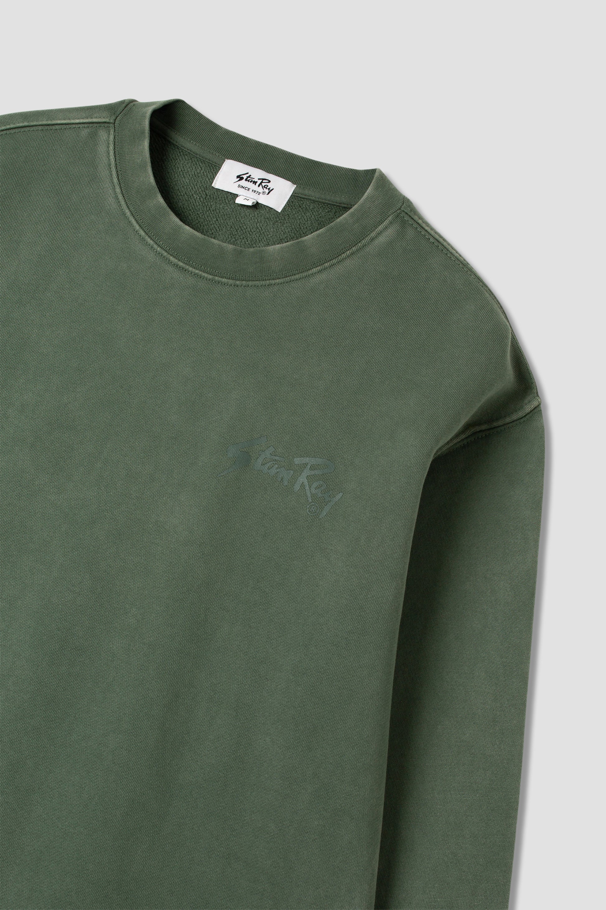 Angled view of Stan OG Crew in washed green