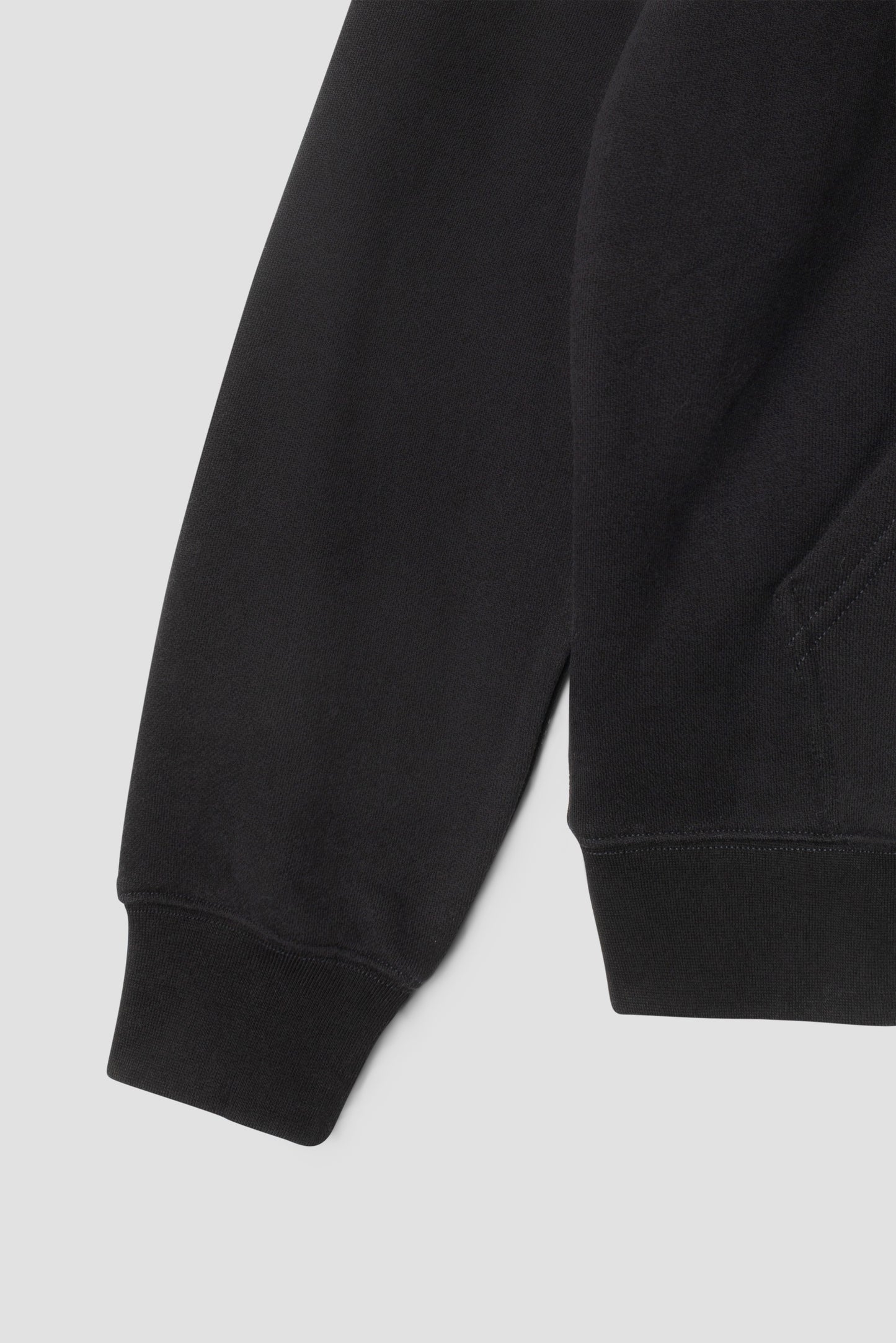 Detail of Stan OG Hood sleeve and pocket, black