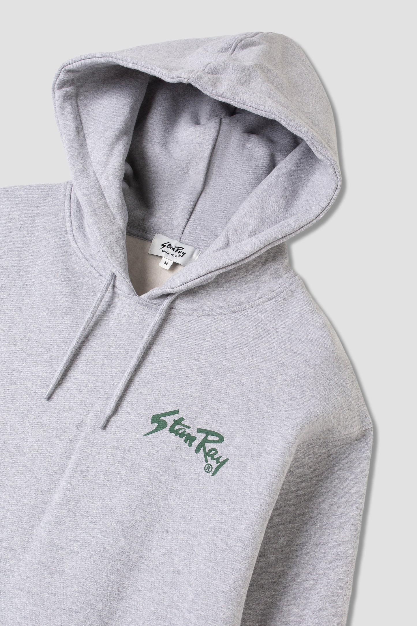 Stan OG Hood in Grey Marl with green logo angled view