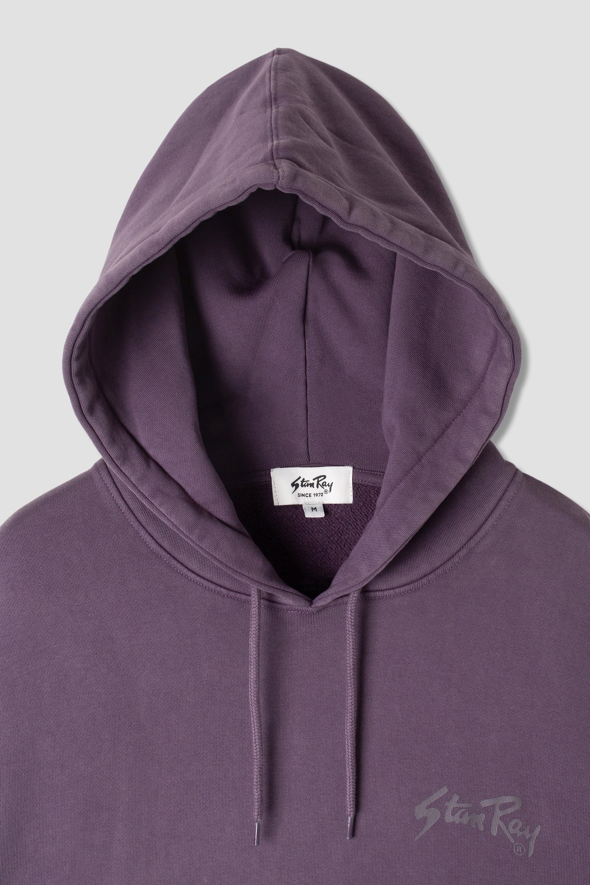 Close-up of Stan OG Hood hood and label