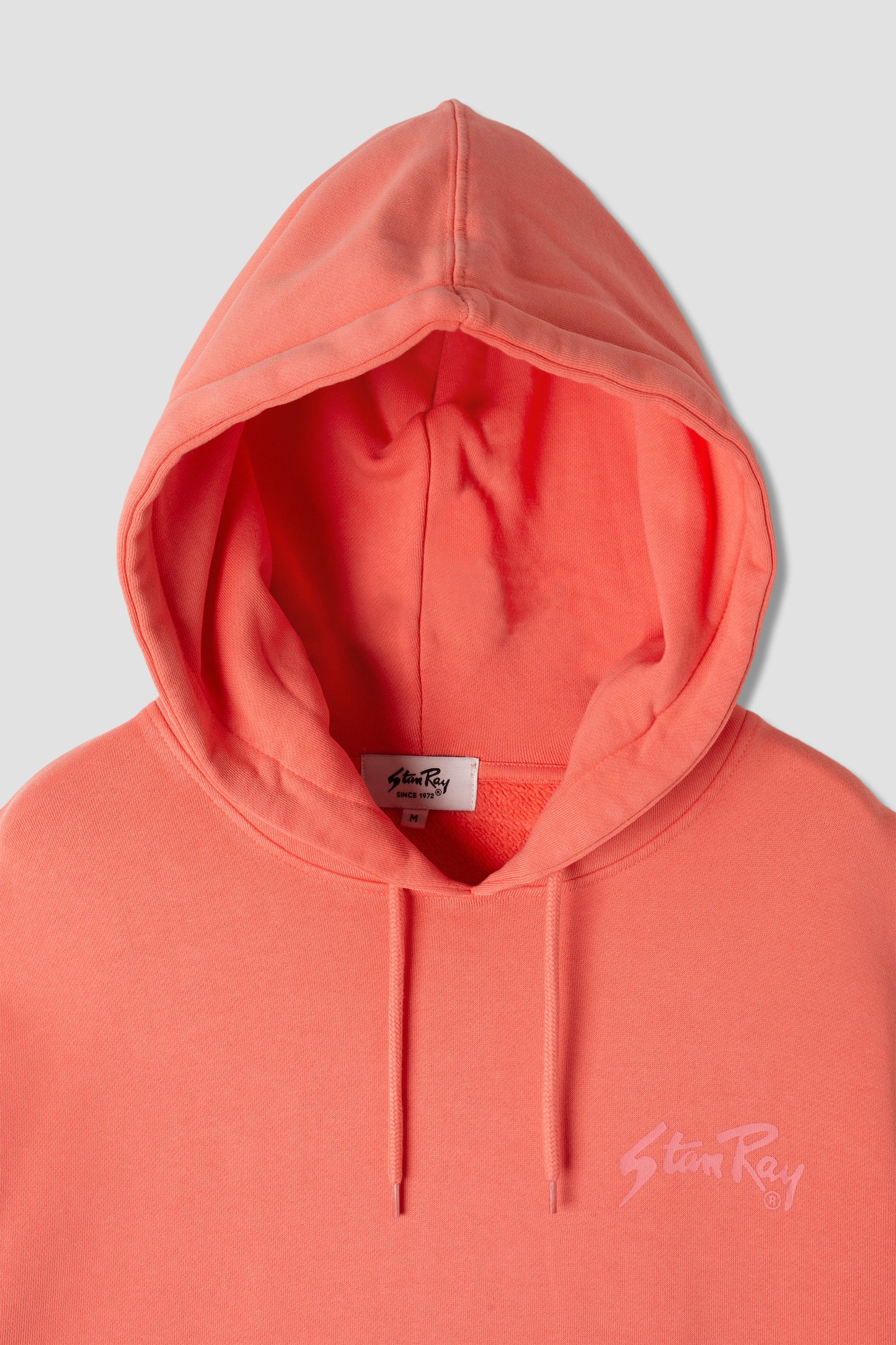 Close-up of Stan OG Hood hood and logo in washed red