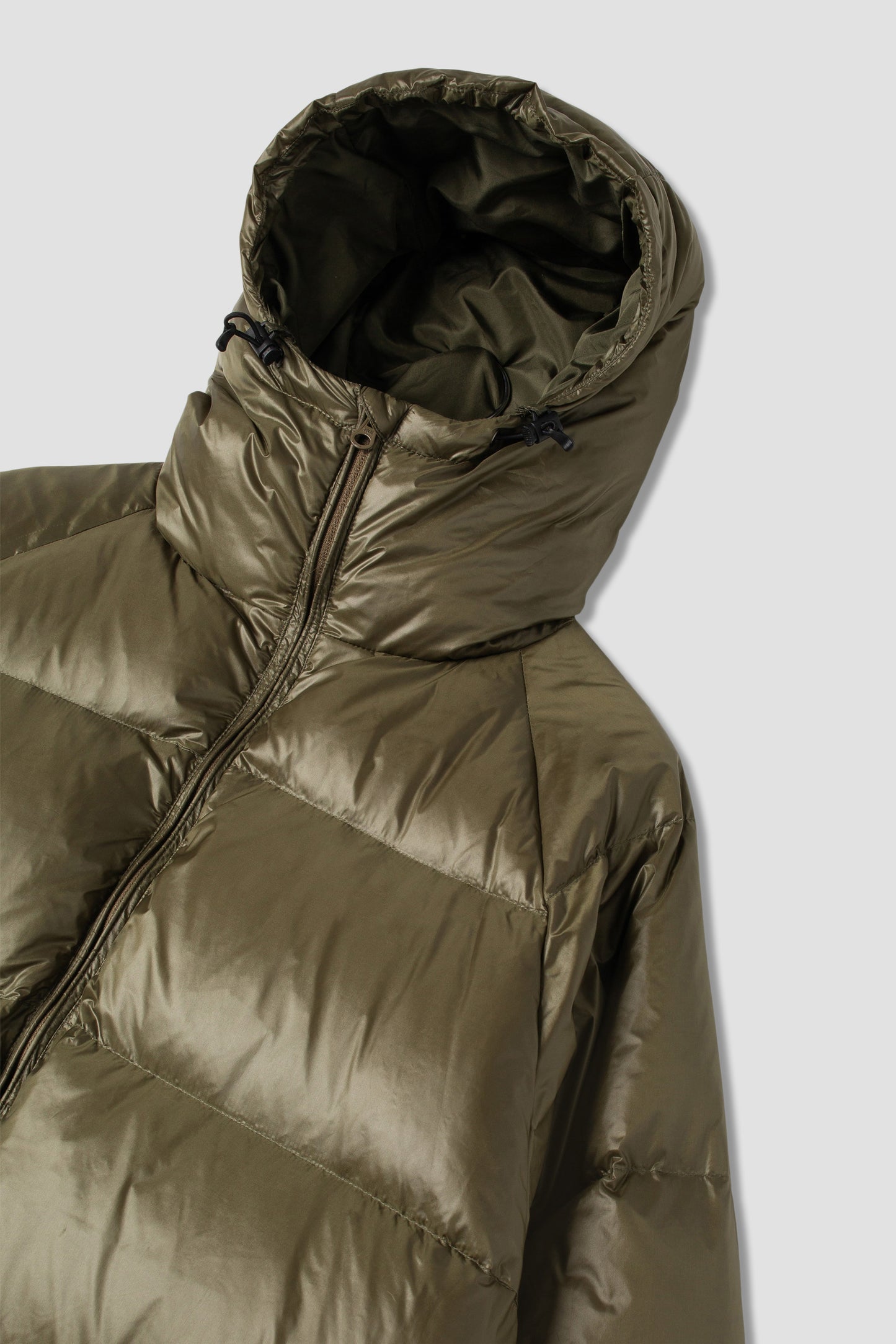 Side view of olive ultralight parka with hood