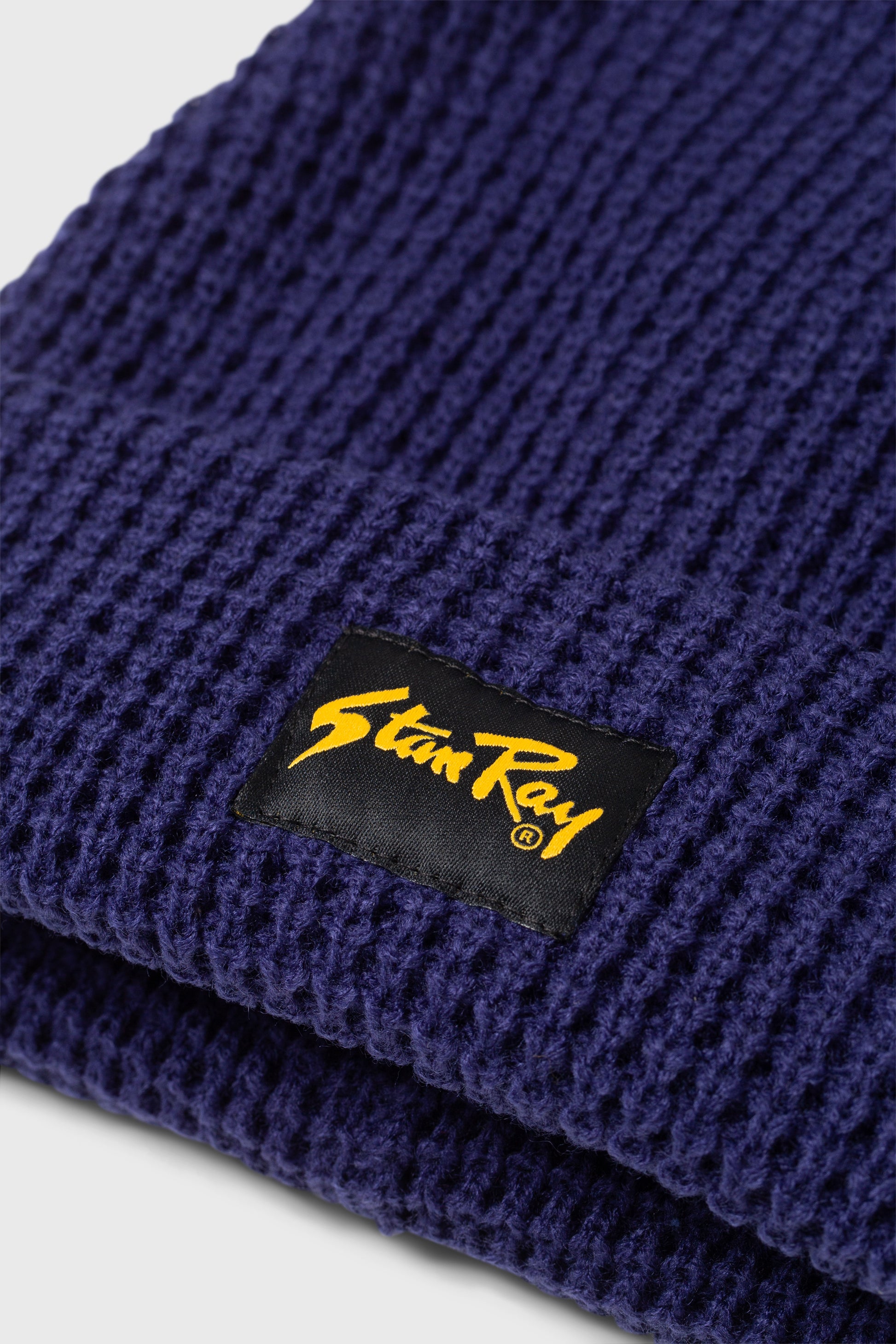 Close-up of Stan Ray Waffle Beanie Navy logo