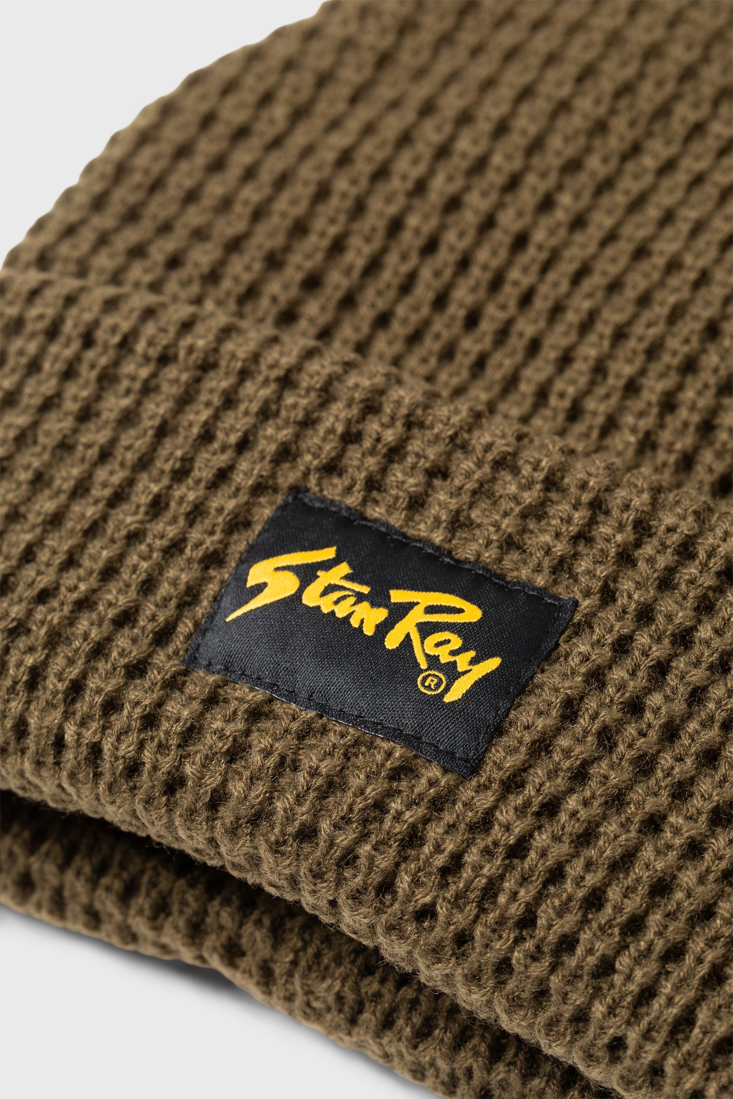 Close-up of Stan Ray Waffle Beanie Olive logo