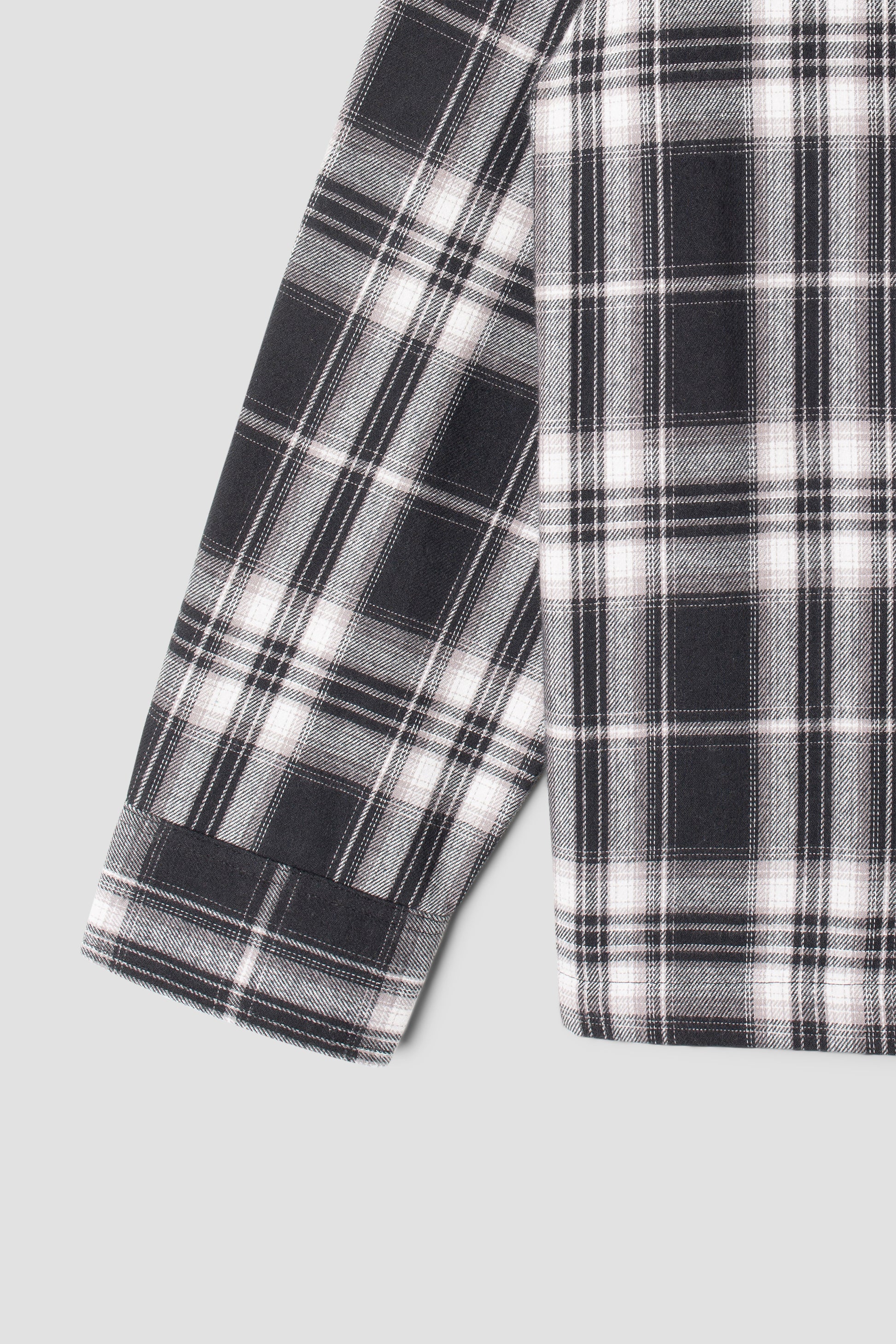 Detail of sleeve on Stan Ray Zip Shirt in black plaid